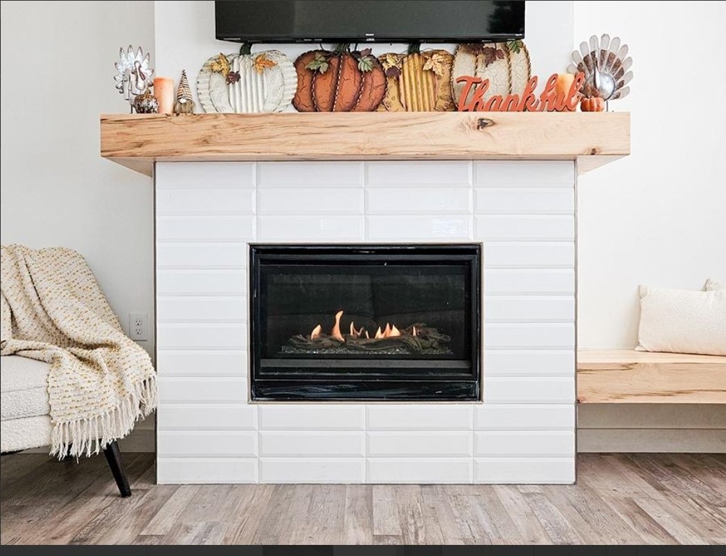 Tile fireplace and wood mantel by Basin New Home