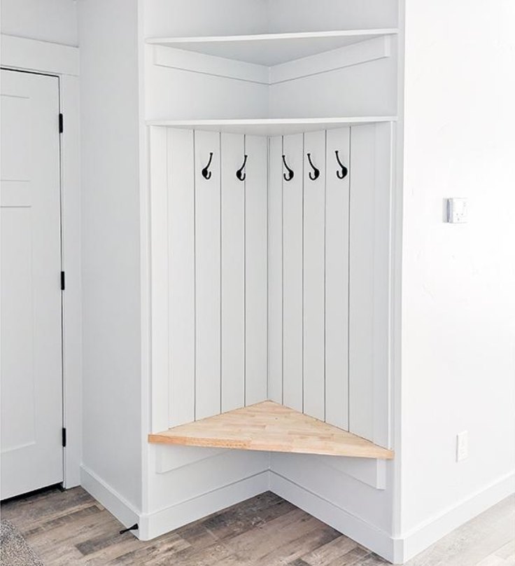 Corner mudroom built-in with butcher-block bench